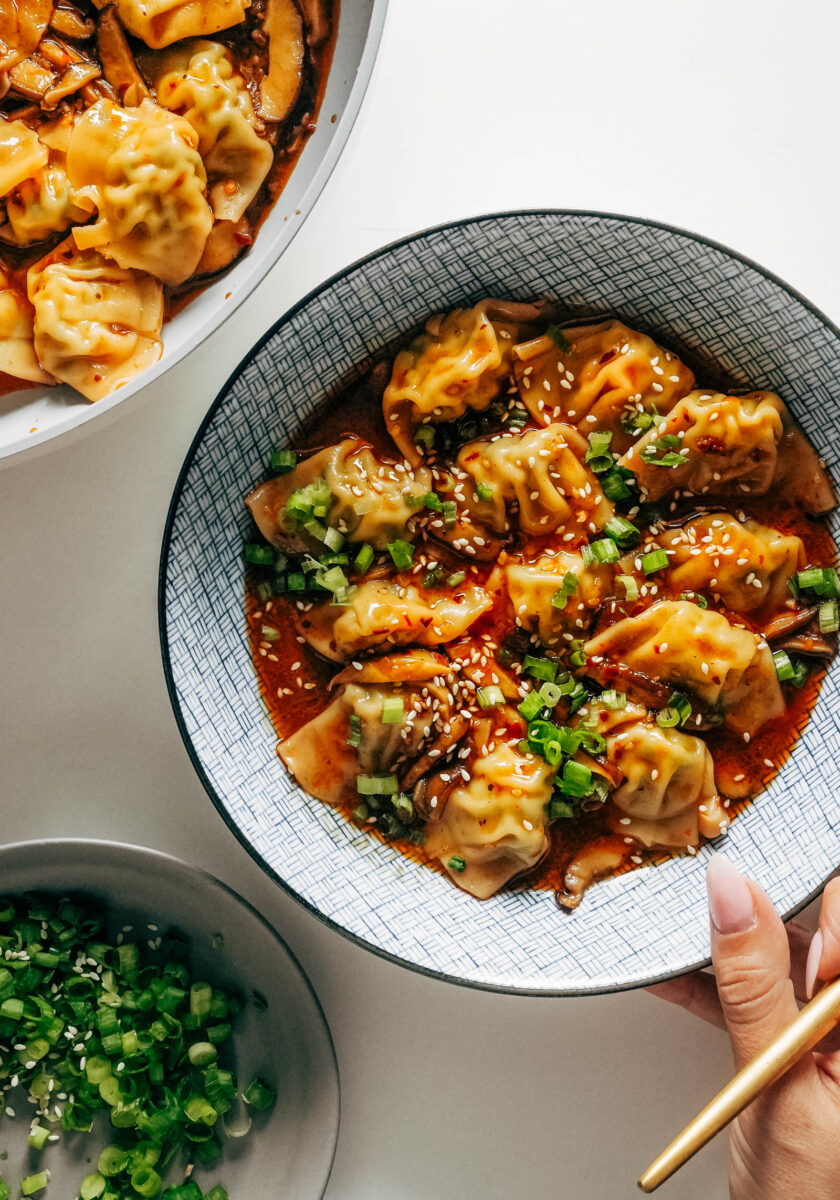 Bowl of chicken wontons in a soup-y broth.