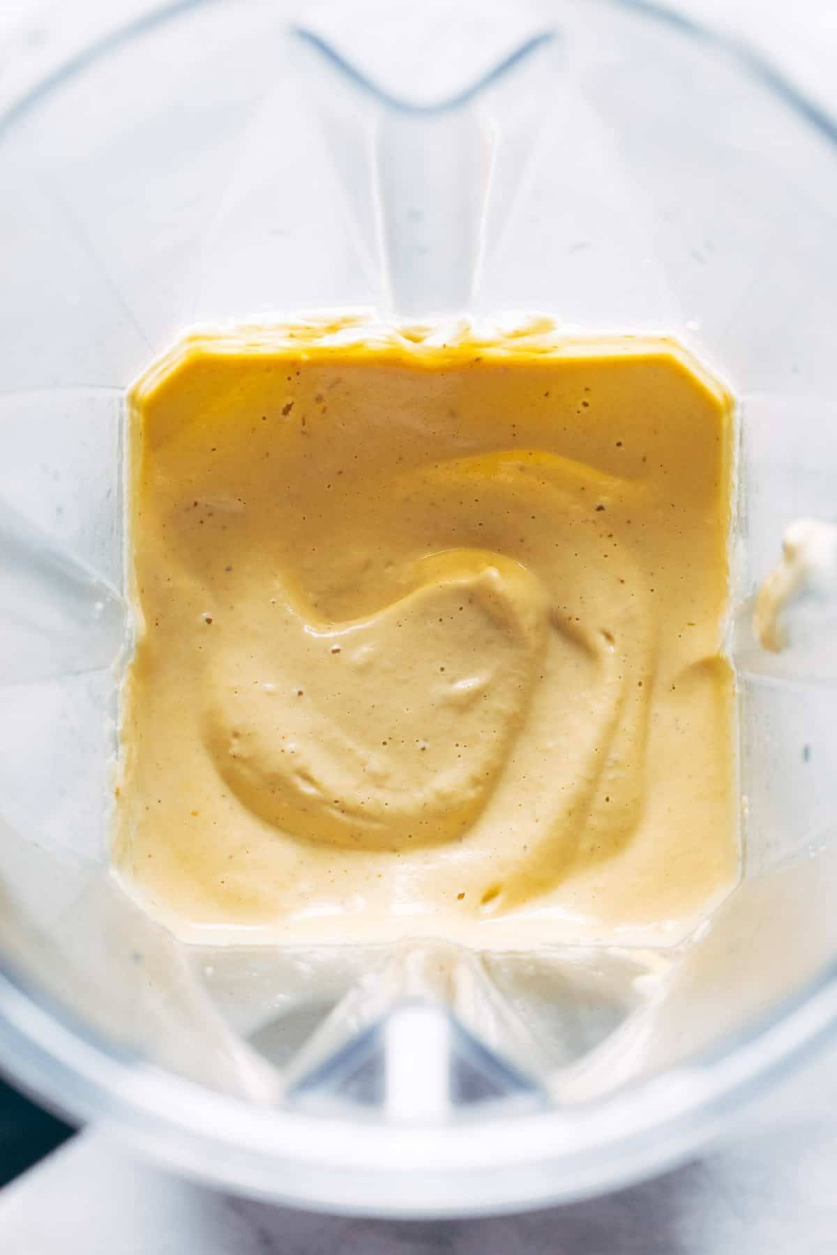 Cashew queso blended in a blender.
