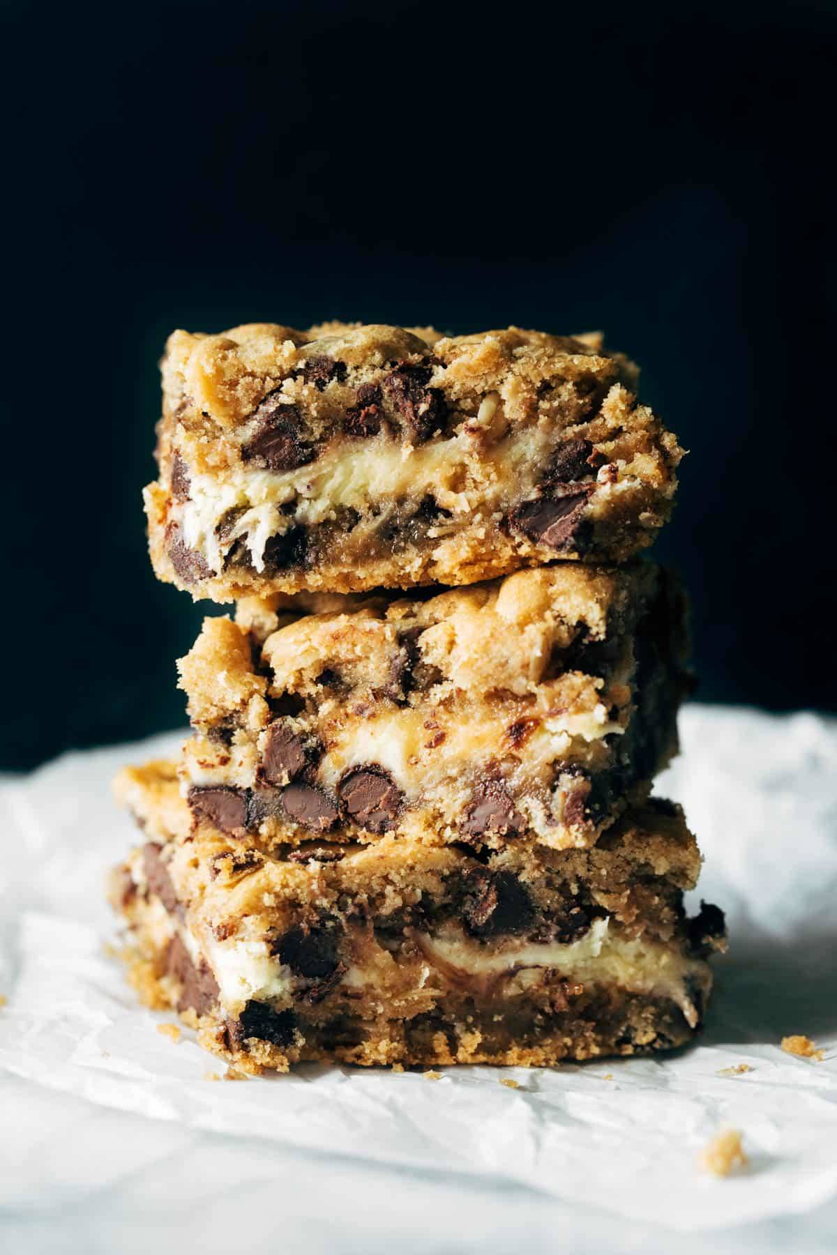 Stack of Peanut Butter Chocolate Chip Cookie Cheesecake Bars.