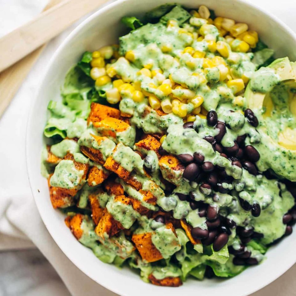 Spicy Southwestern Salad in a bowl with avocado dressing.