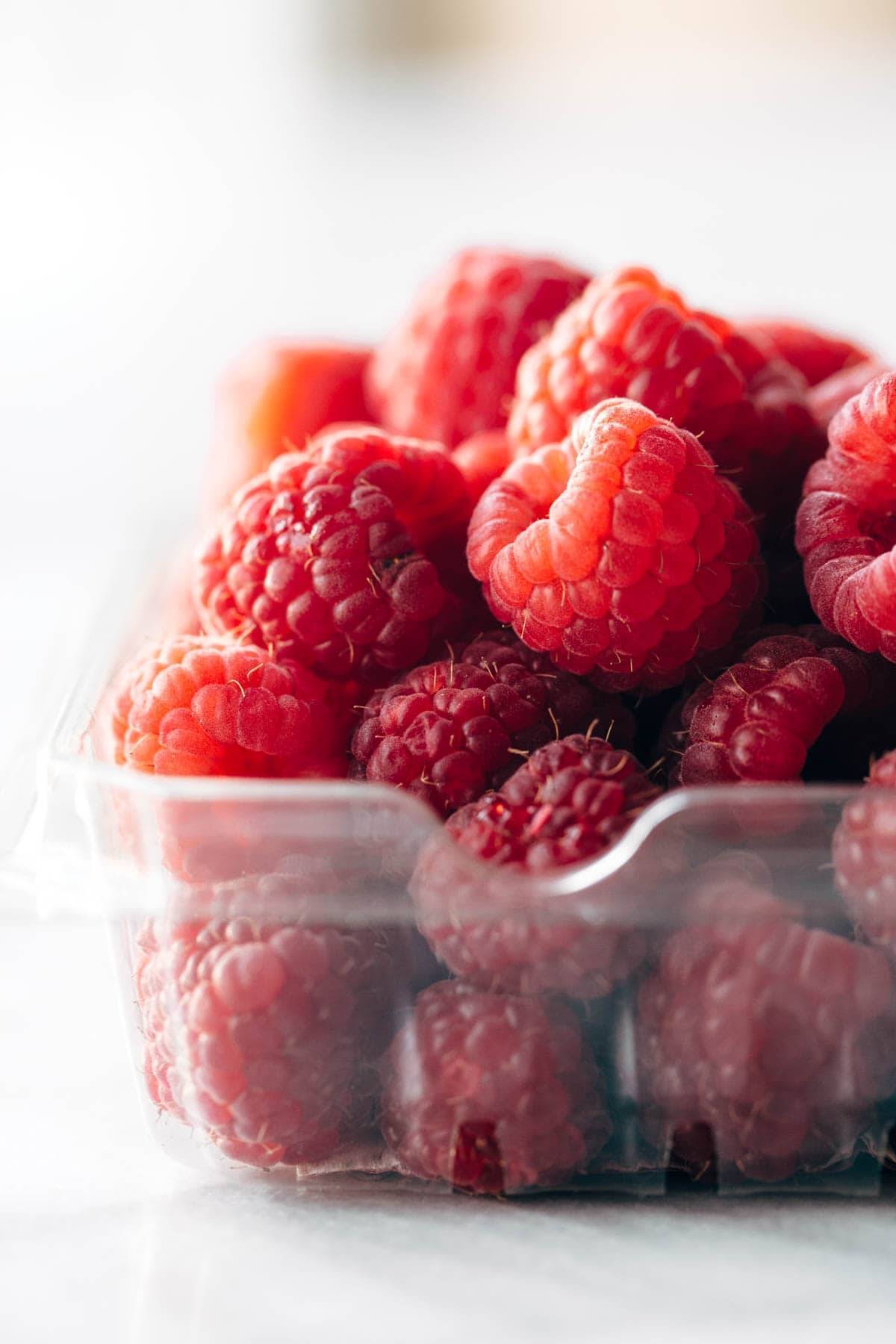 Raspberries in a container.