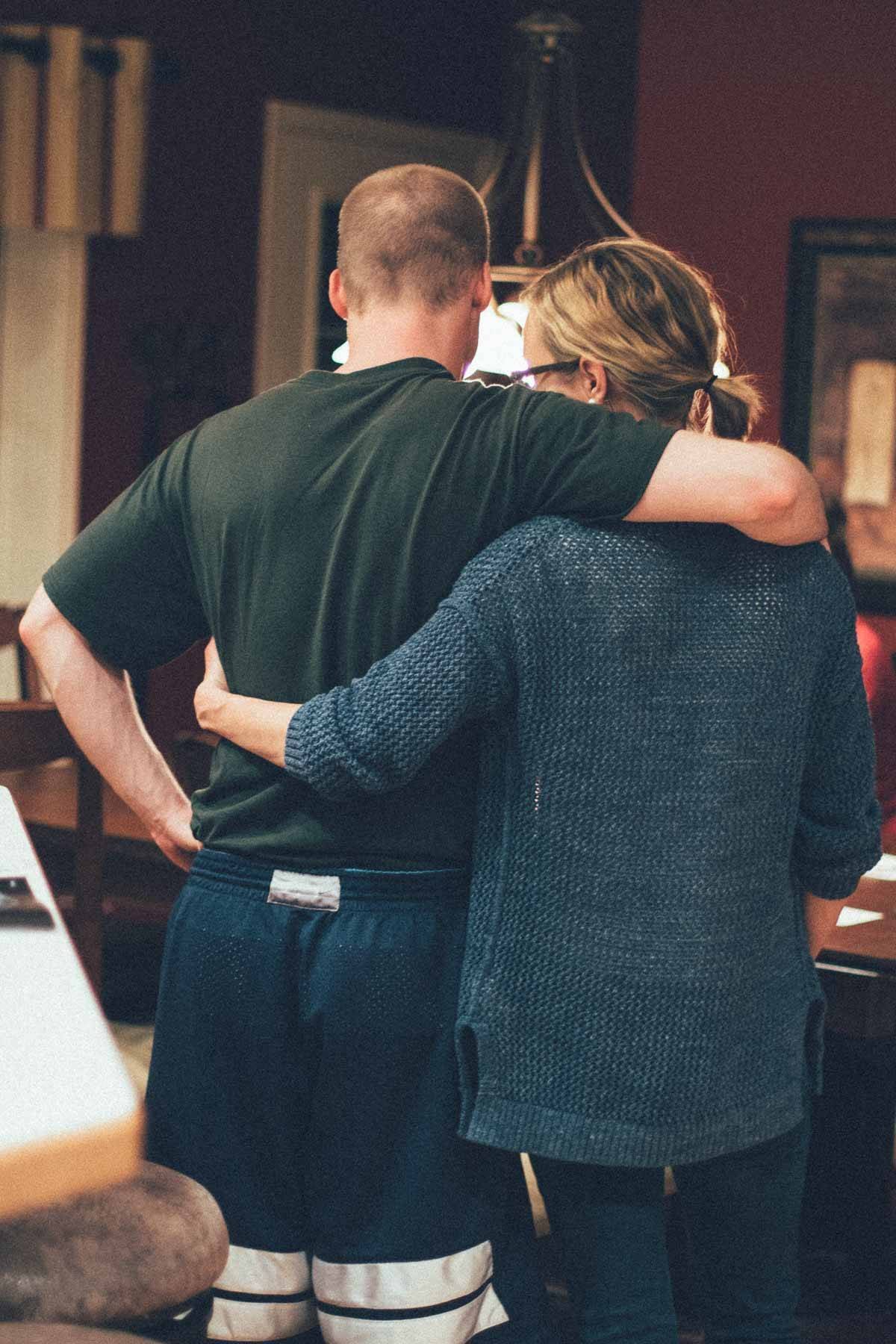 Man and woman hugging.