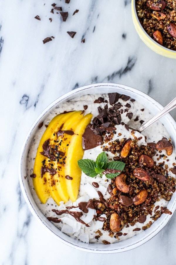 Coconut Banana Oats Smoothie Bowl with Crunchy Black Sesame Quinoa Cereal + Mango.