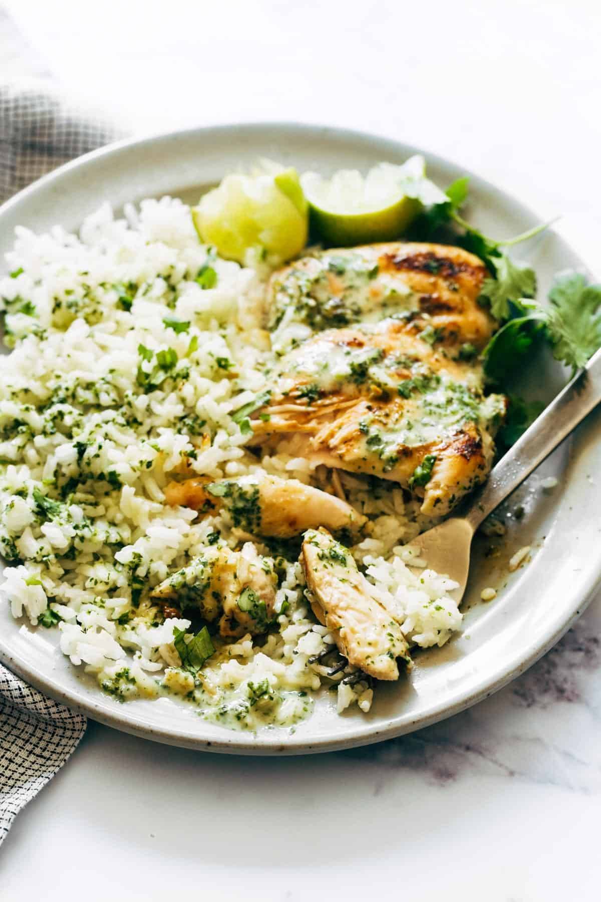 Coconut Lime Grilled Chicken and rice with bite on fork.