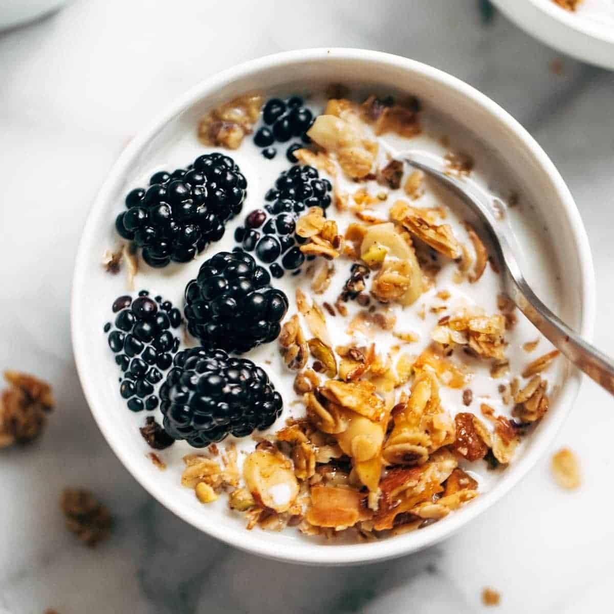 oats, unsweetened coconut, sliced almonds, flax, honey, and raisins in a bowl