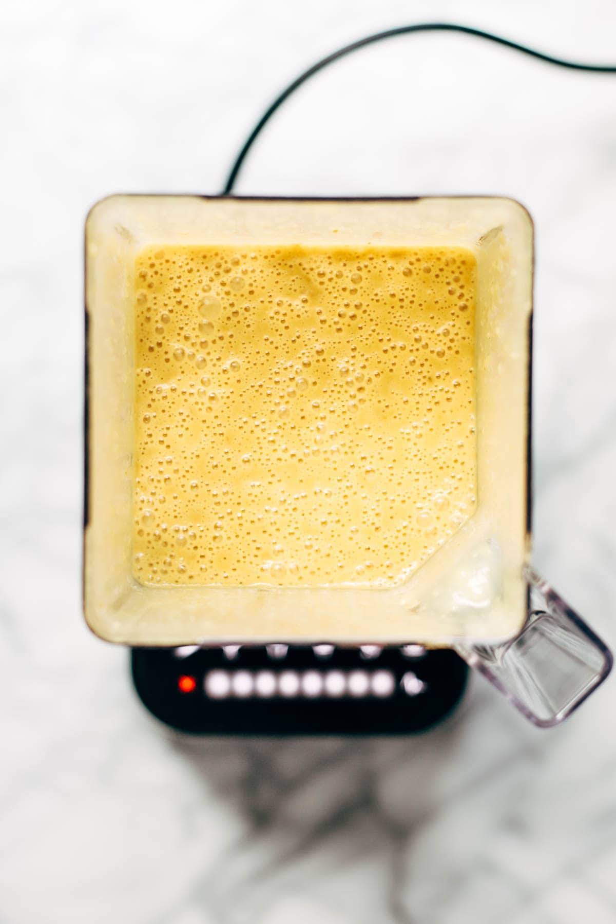 Blended coconut curry soup in a blender.