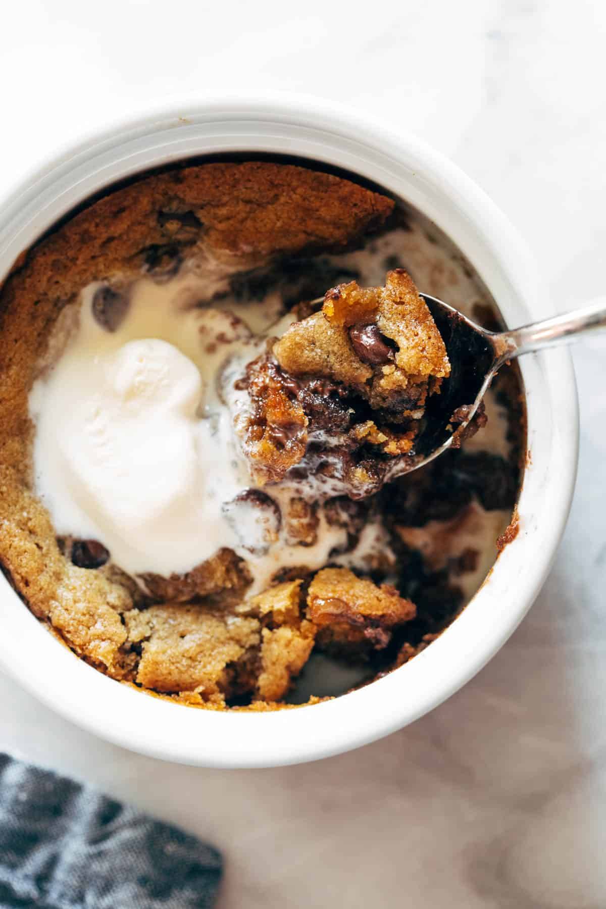 Deep dish cookie bowl with bite taken out.