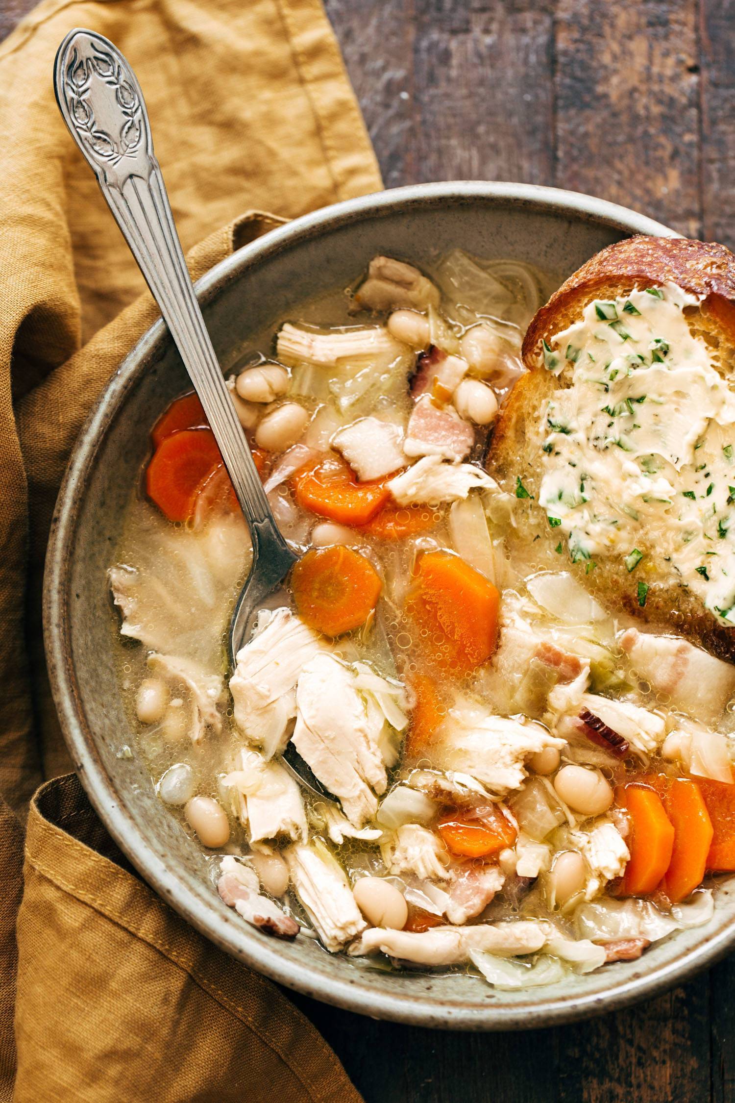 Country chicken soup in a bowl with bread. 