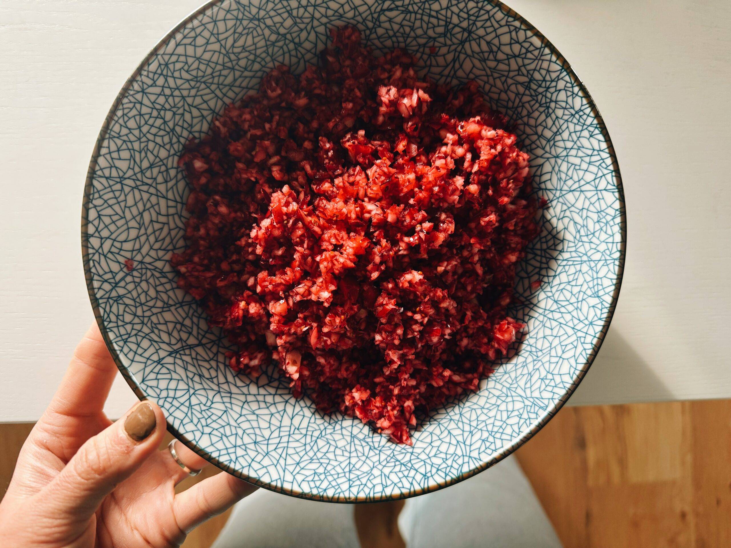 Chopped cranberries in a bowl.