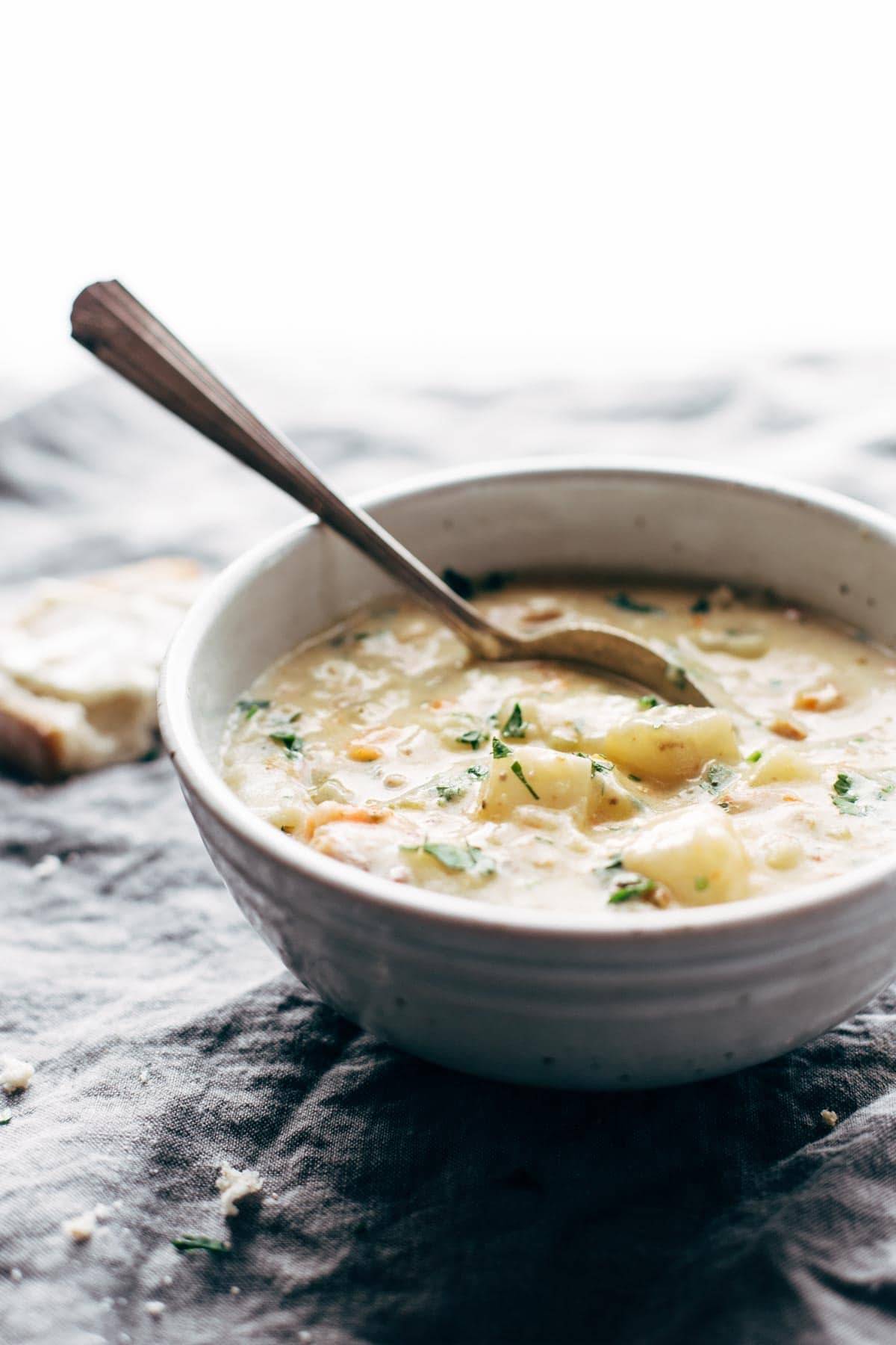 creamy potato soup in a bowl with a spoon
