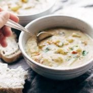 Creamy Potato Soup in bowl with a spoon.