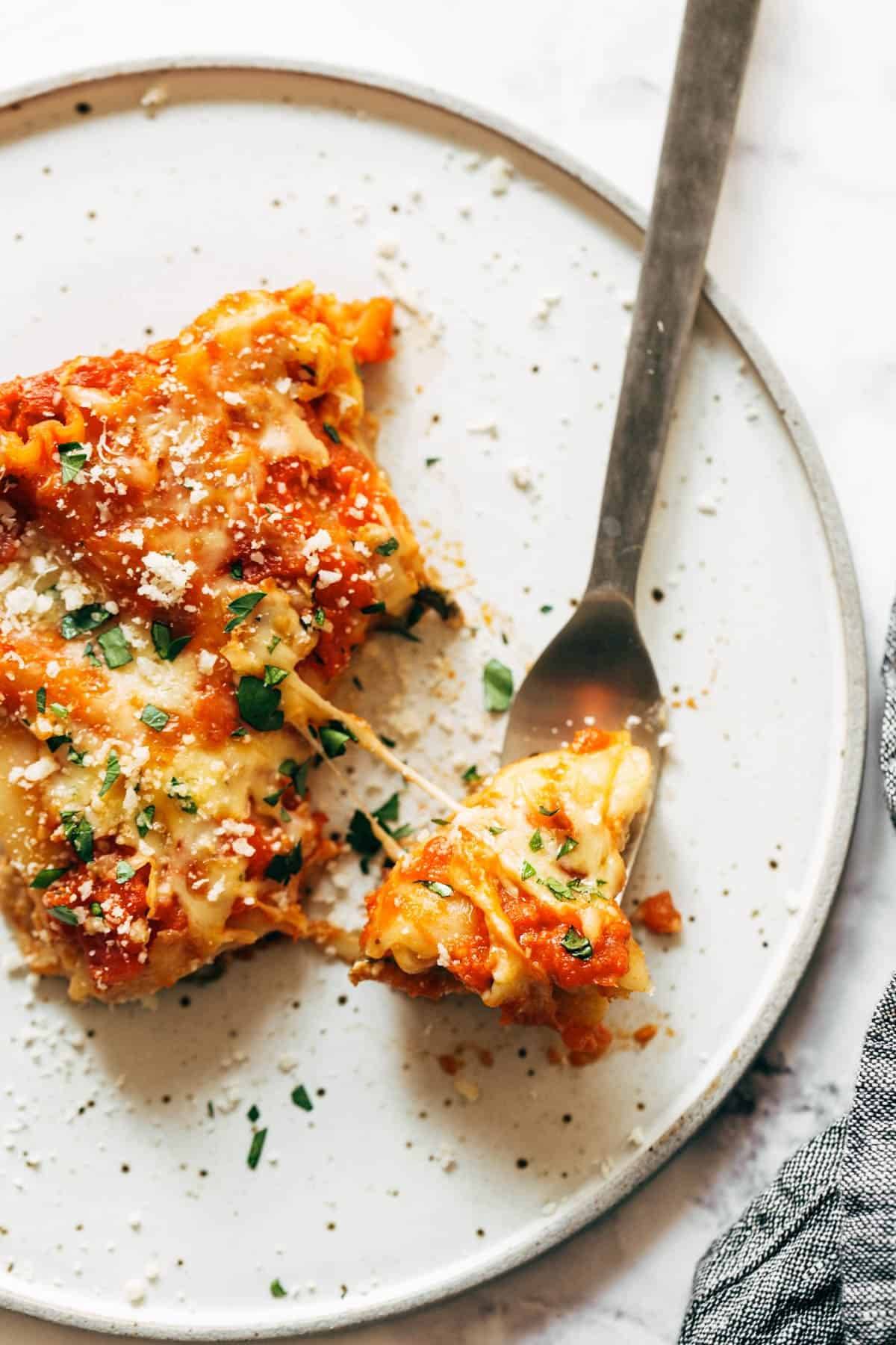 Lasagna florentine with a bite on a plate.