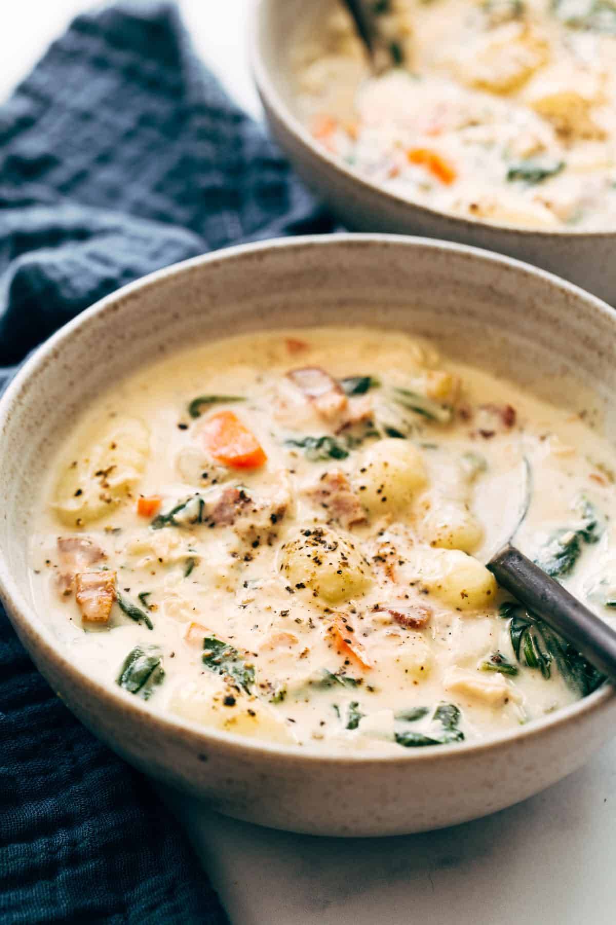 Crockpot Chicken Gnocchi Soup in a bowl with a spoon.
