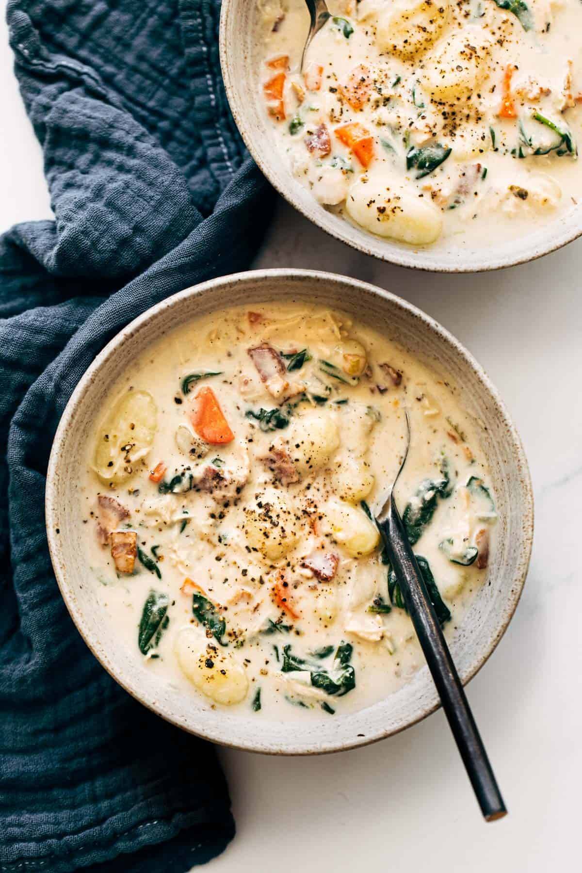 Crockpot Chicken Gnocchi Soup in a bowl with a spoon.