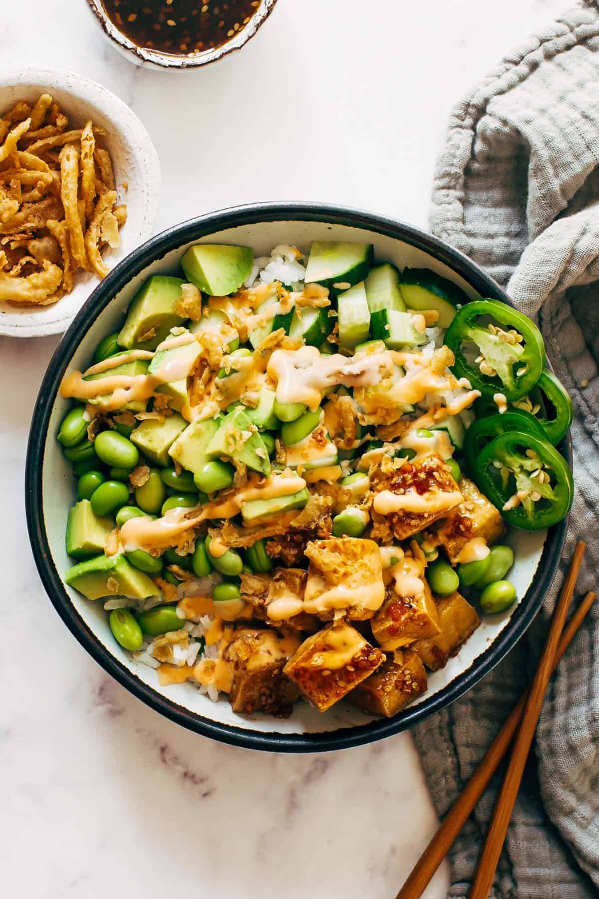 Crunchy Roll Bowl with spicy mayo drizzled on top.