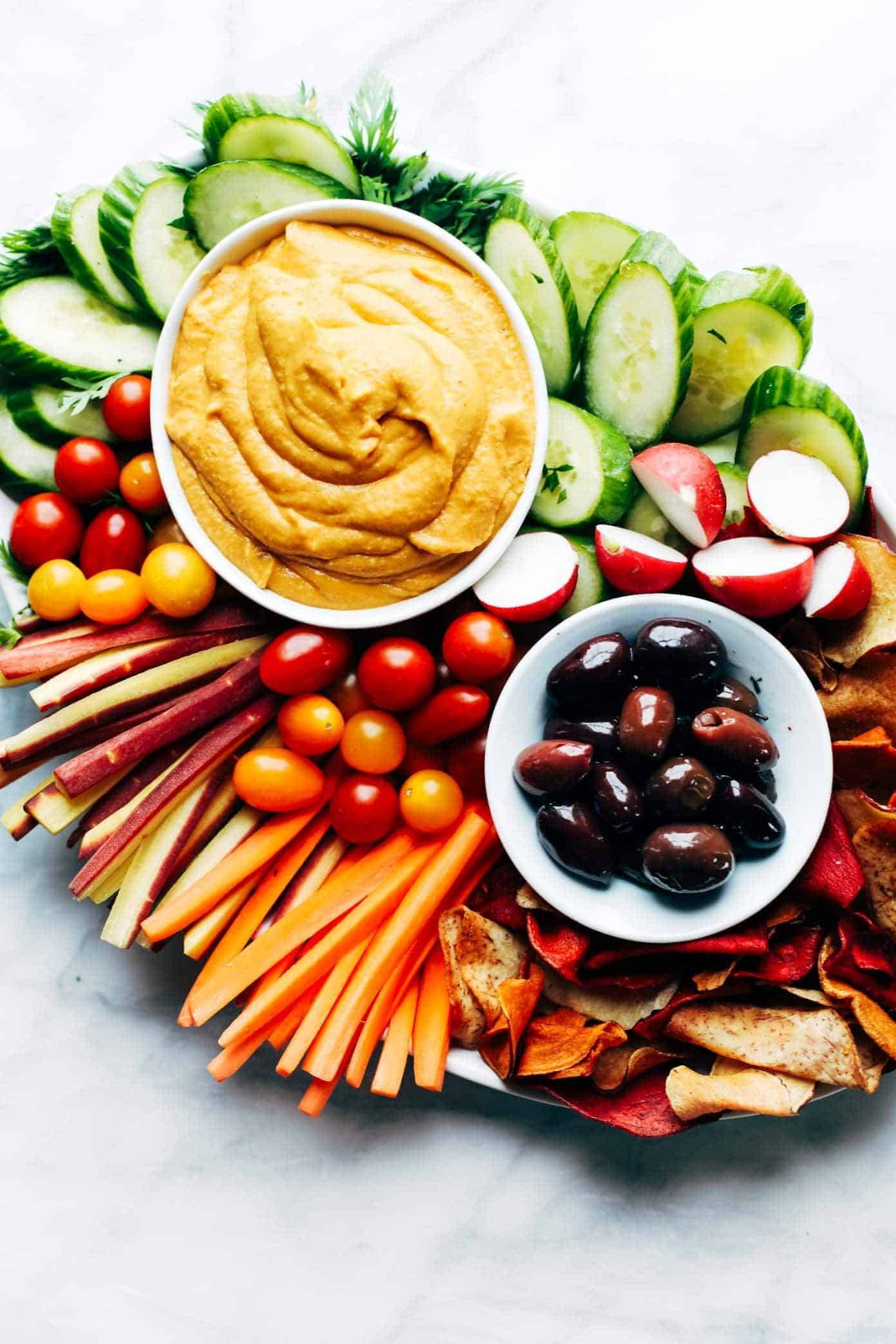Curry Hummus on a plate with veggies.