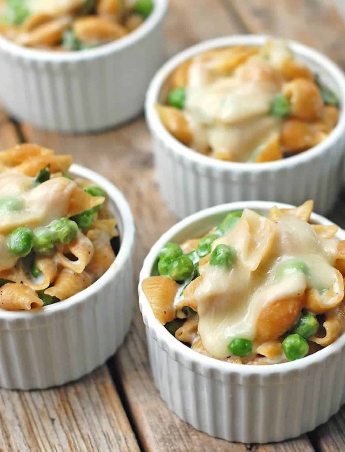 Pasta baked in ramekins and topped with cheese.