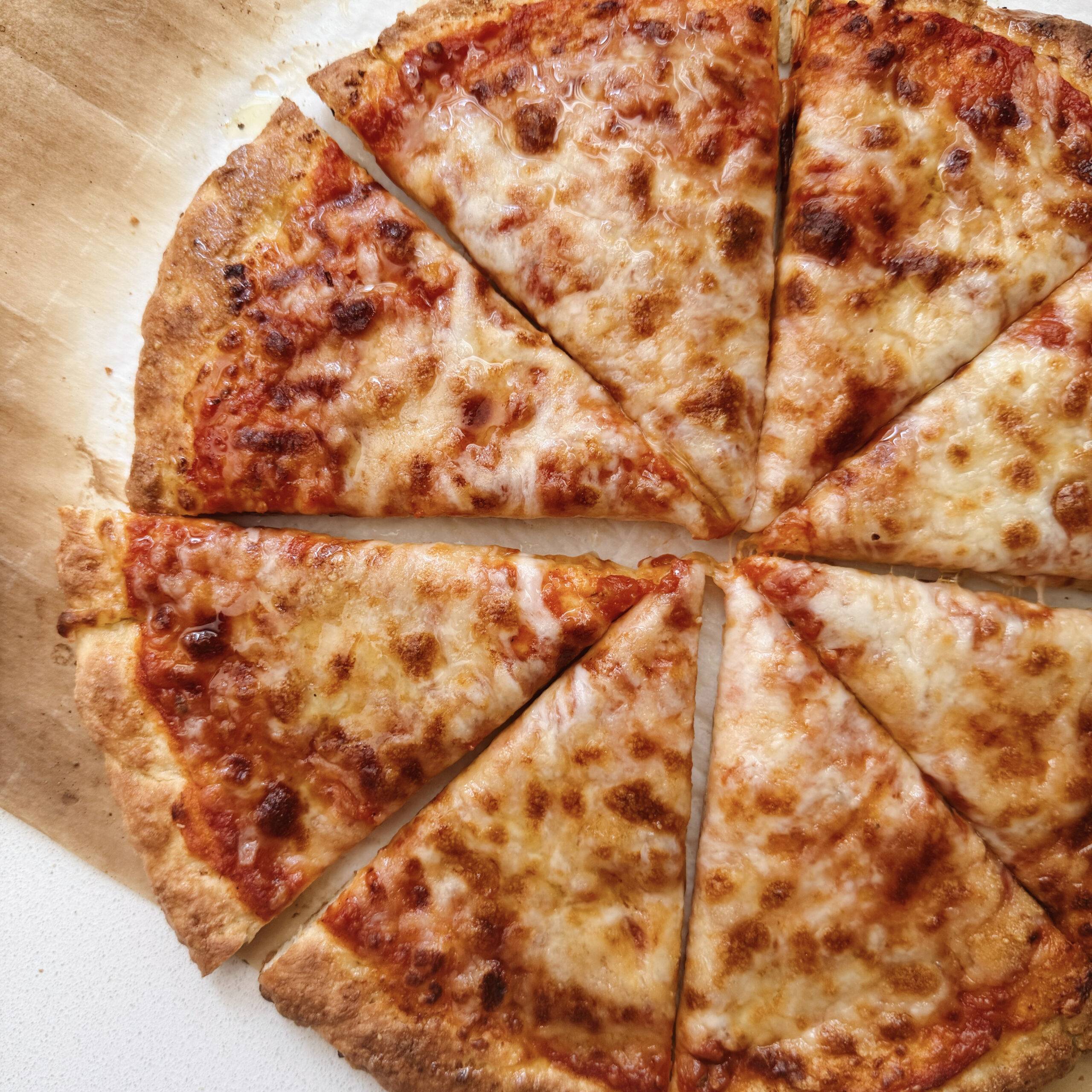 Finished cottage cheese pizza cut into slices.