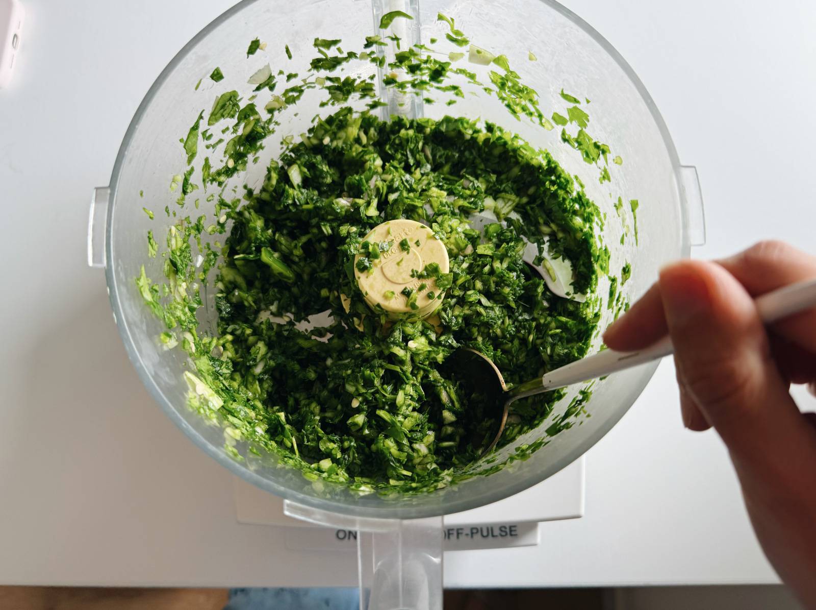 Minced greens for the green rice in a food processor