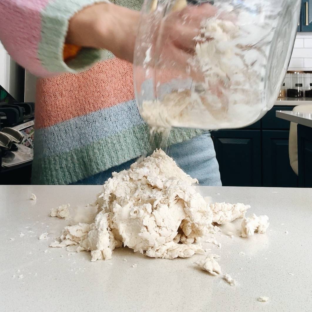 Forming dough on a counter.