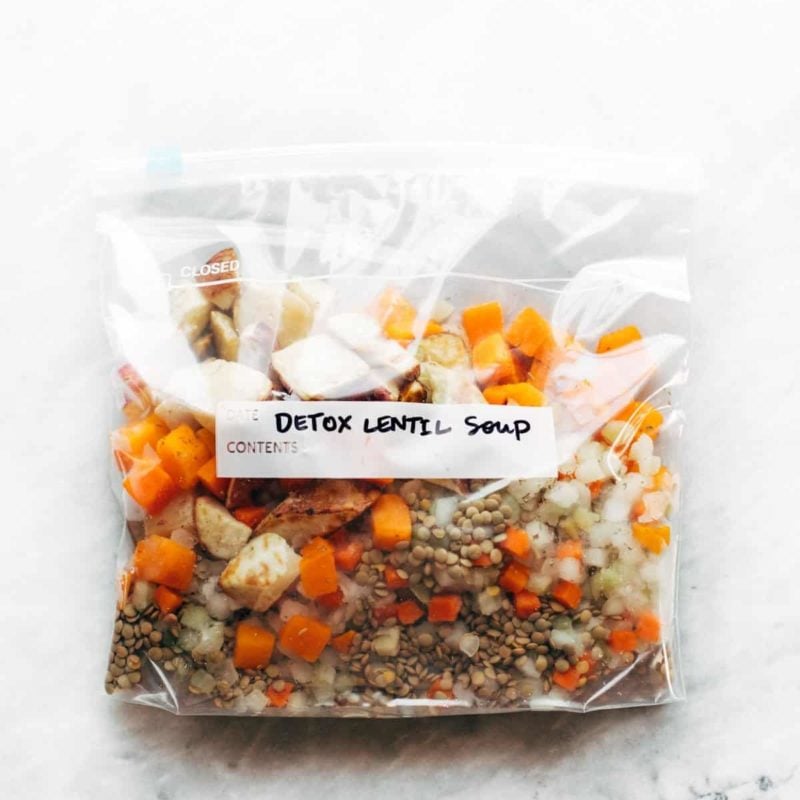 A clear bag with mixed vegetables and lentils in it.