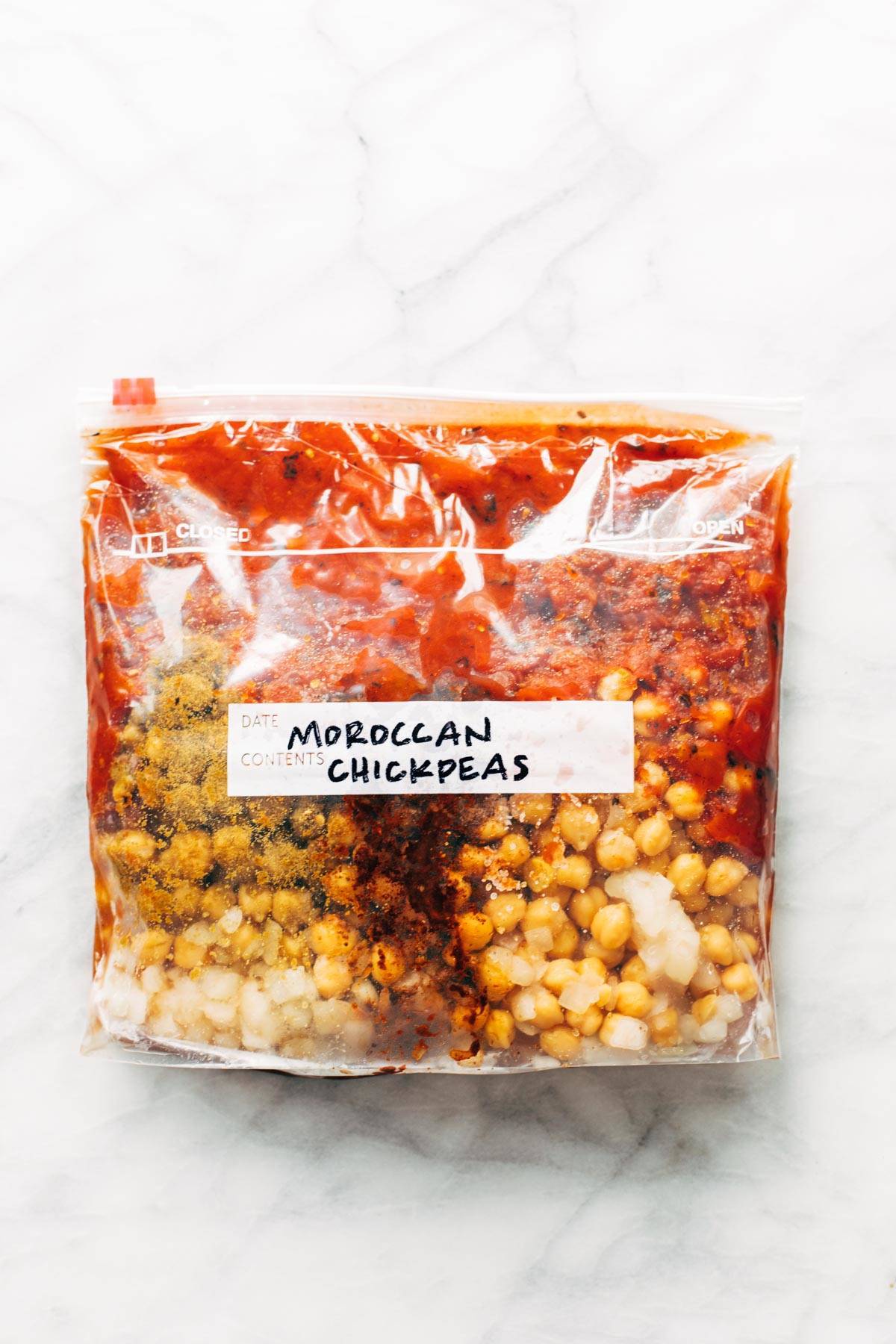 A clear bag with food and a label reading "Moroccan Chickpeas"