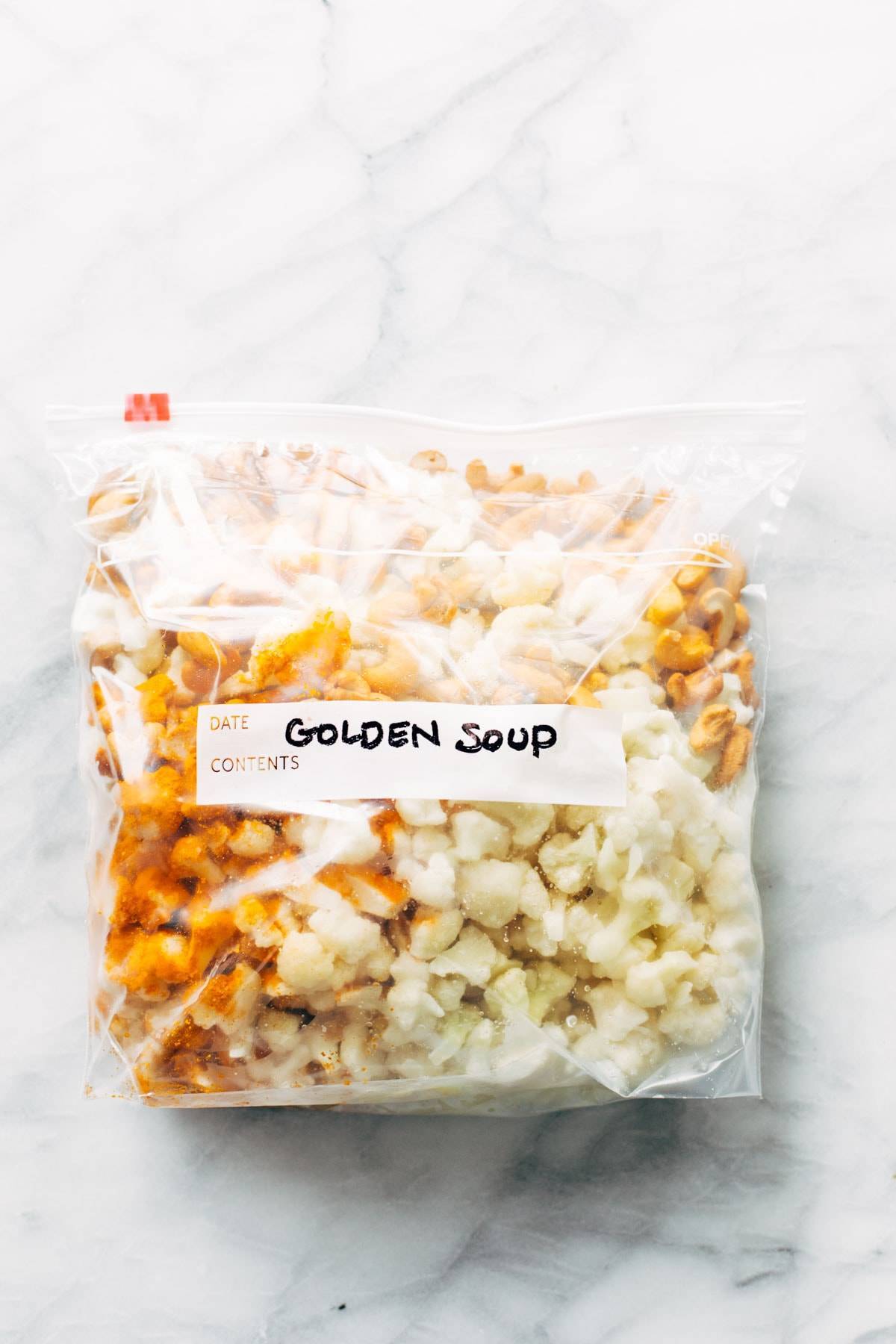 A clear bag labeled Golden Soup.