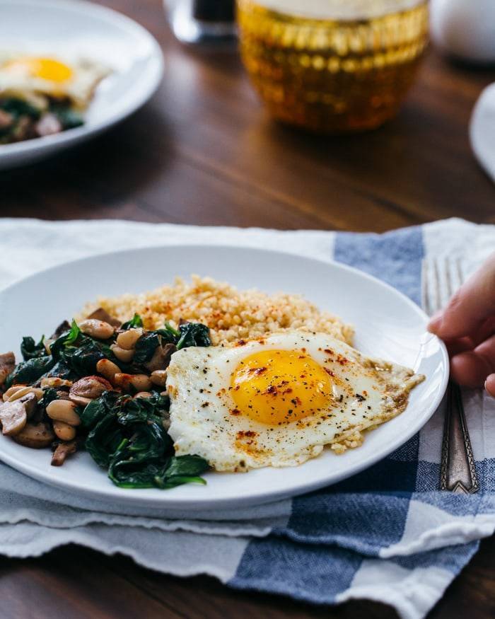 Fried Eggs with Bulgur and Spinach.