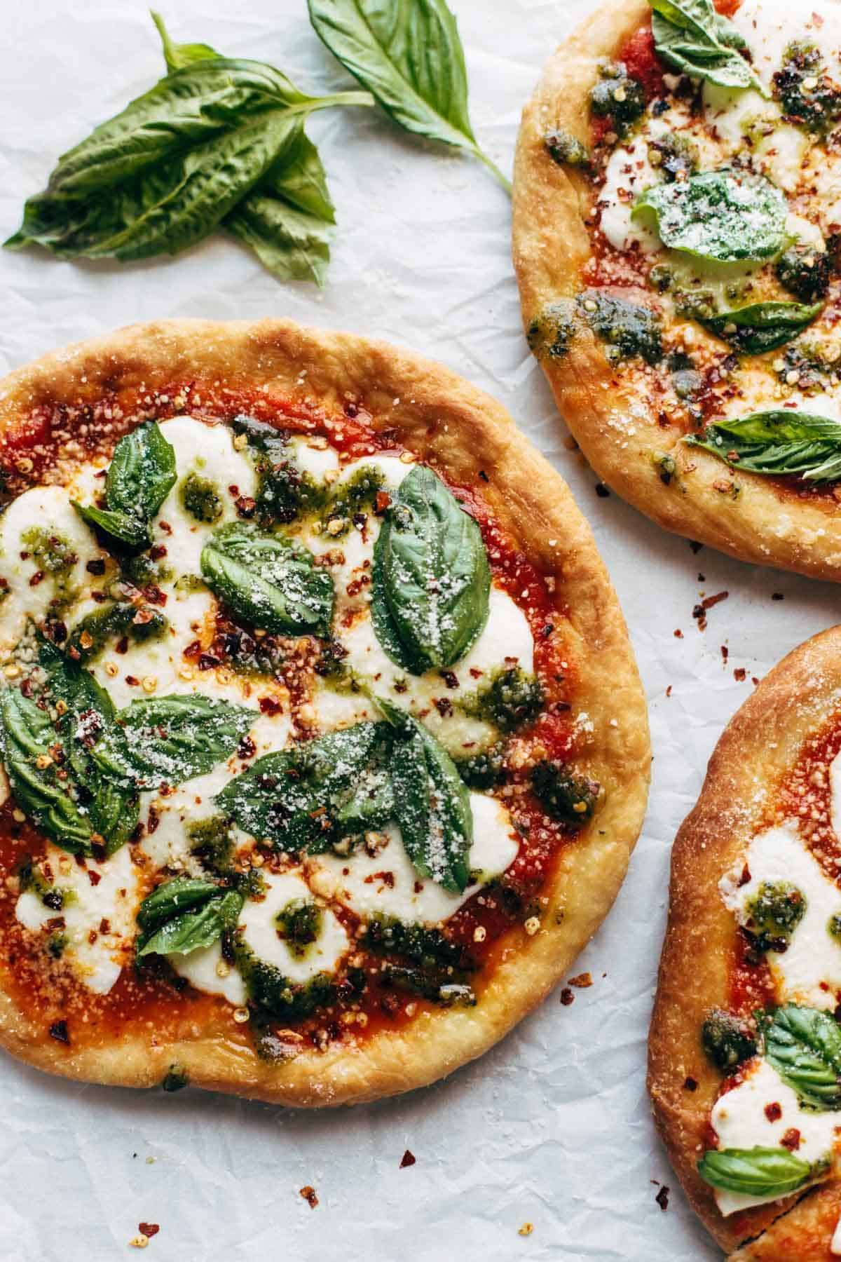 Fried Pizzas on parchment paper.