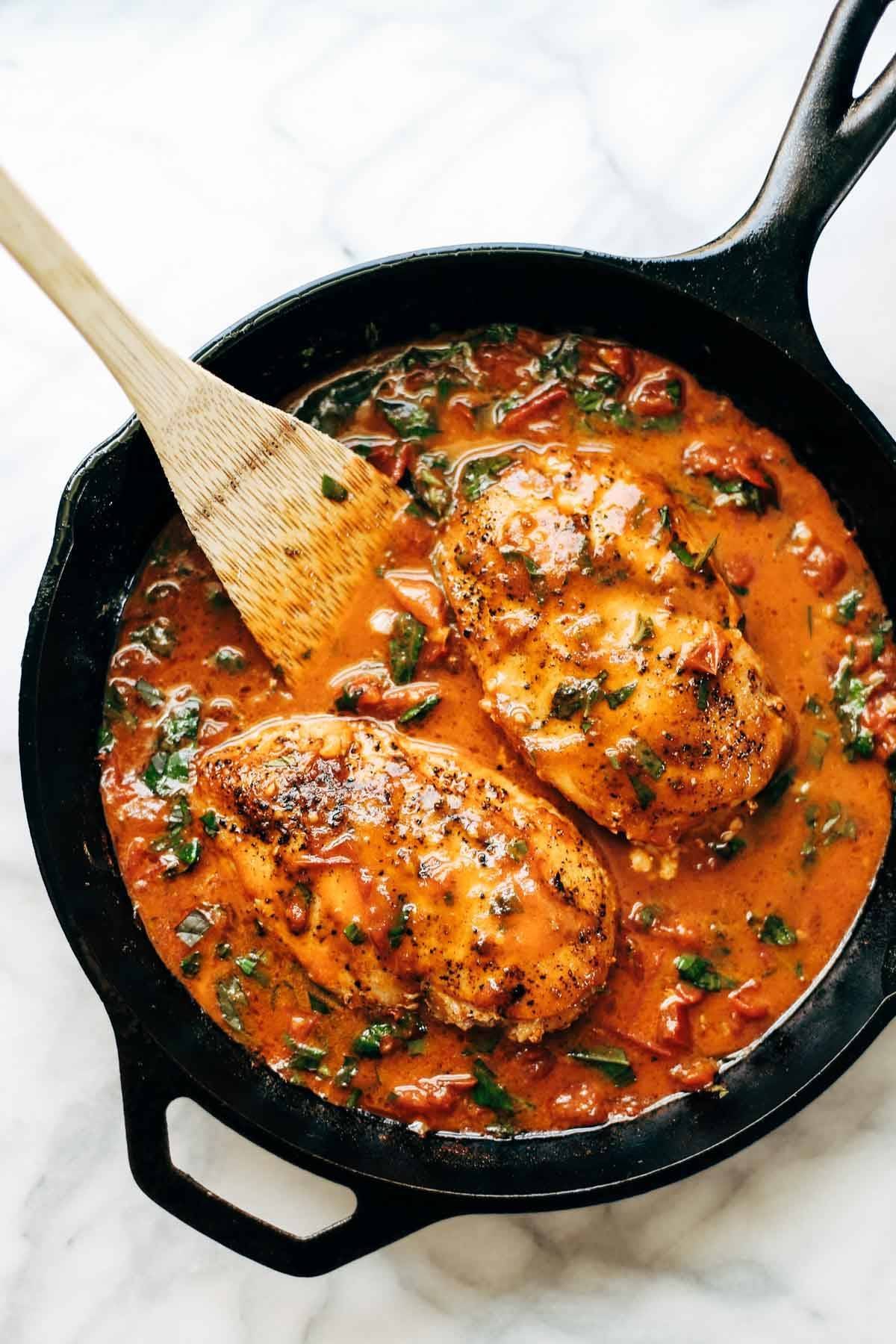 Garlic Basil Chicken - you won't believe that this easy real food recipe only requires 7 ingredients like basil, garlic, olive oil, tomatoes, and butter. | pinchofyum.com