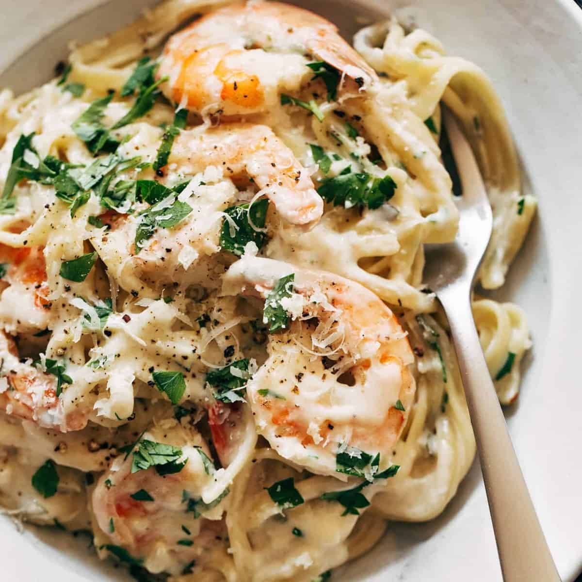 Garlic Butter White Wine Shrimp Linguine on a plate with a fork.