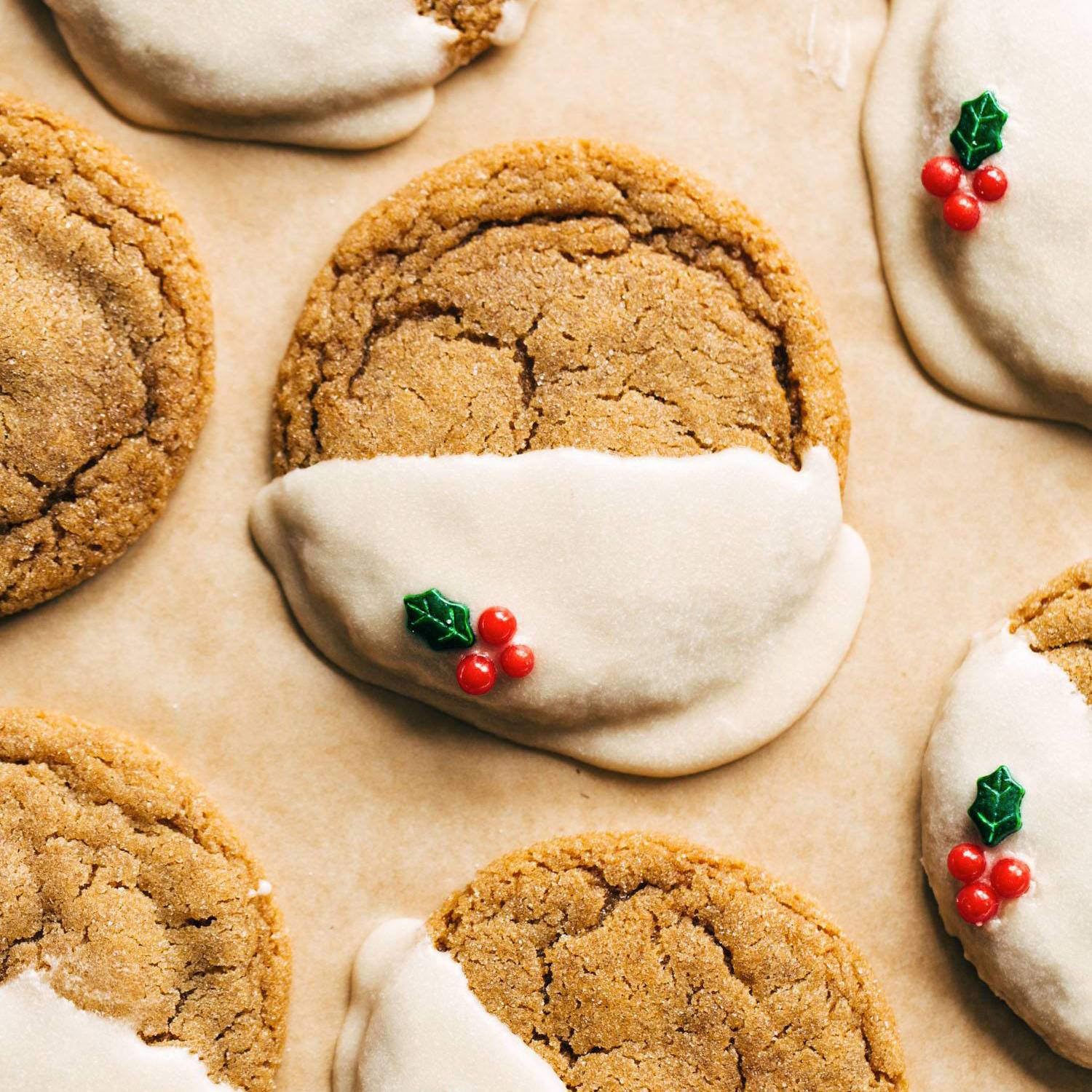 Gingerbread cookies with icing and holly sprinkles