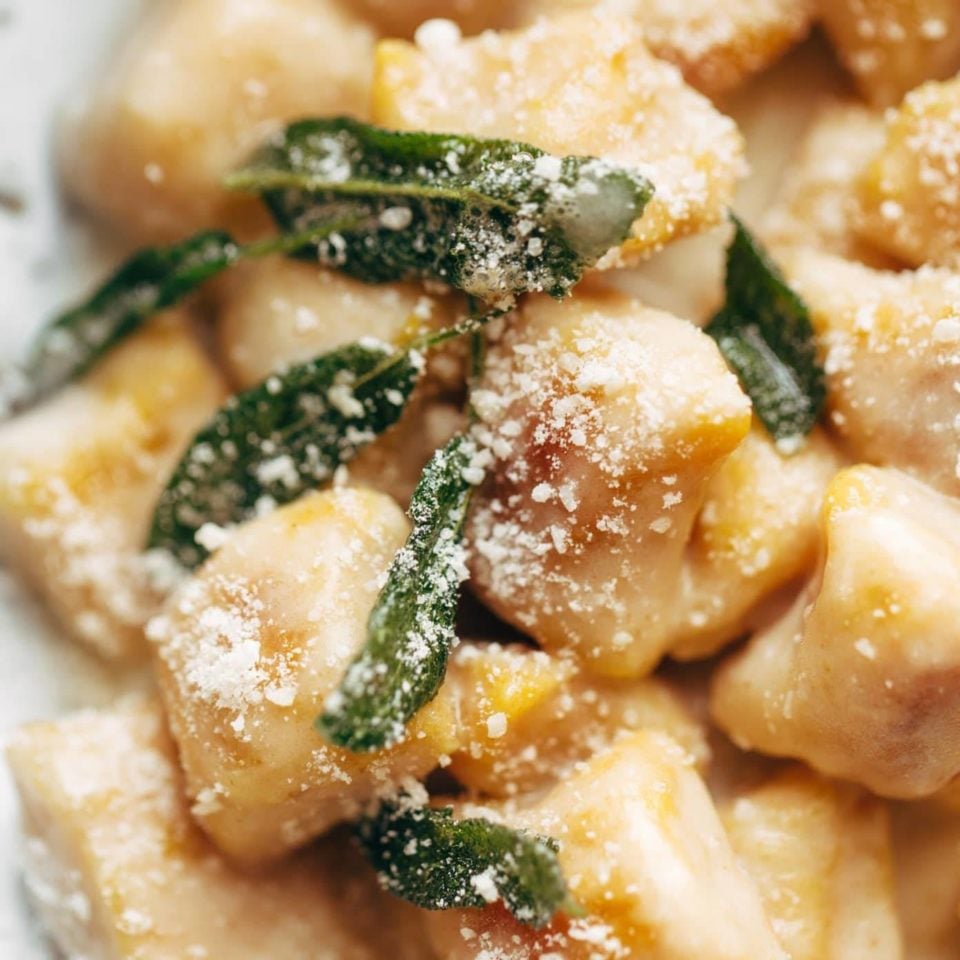 Pumpkin Gnocchi on plate with fried sage.