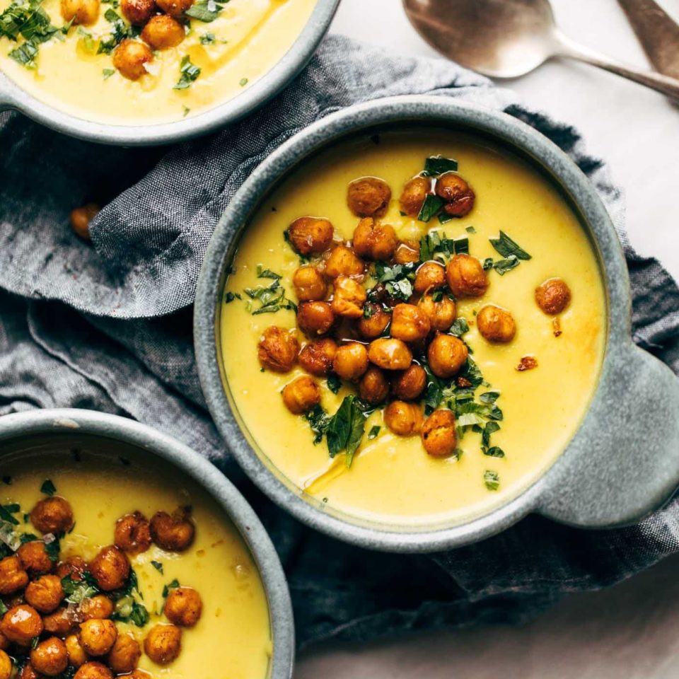 Golden Soup in bowls with chickpea topping.