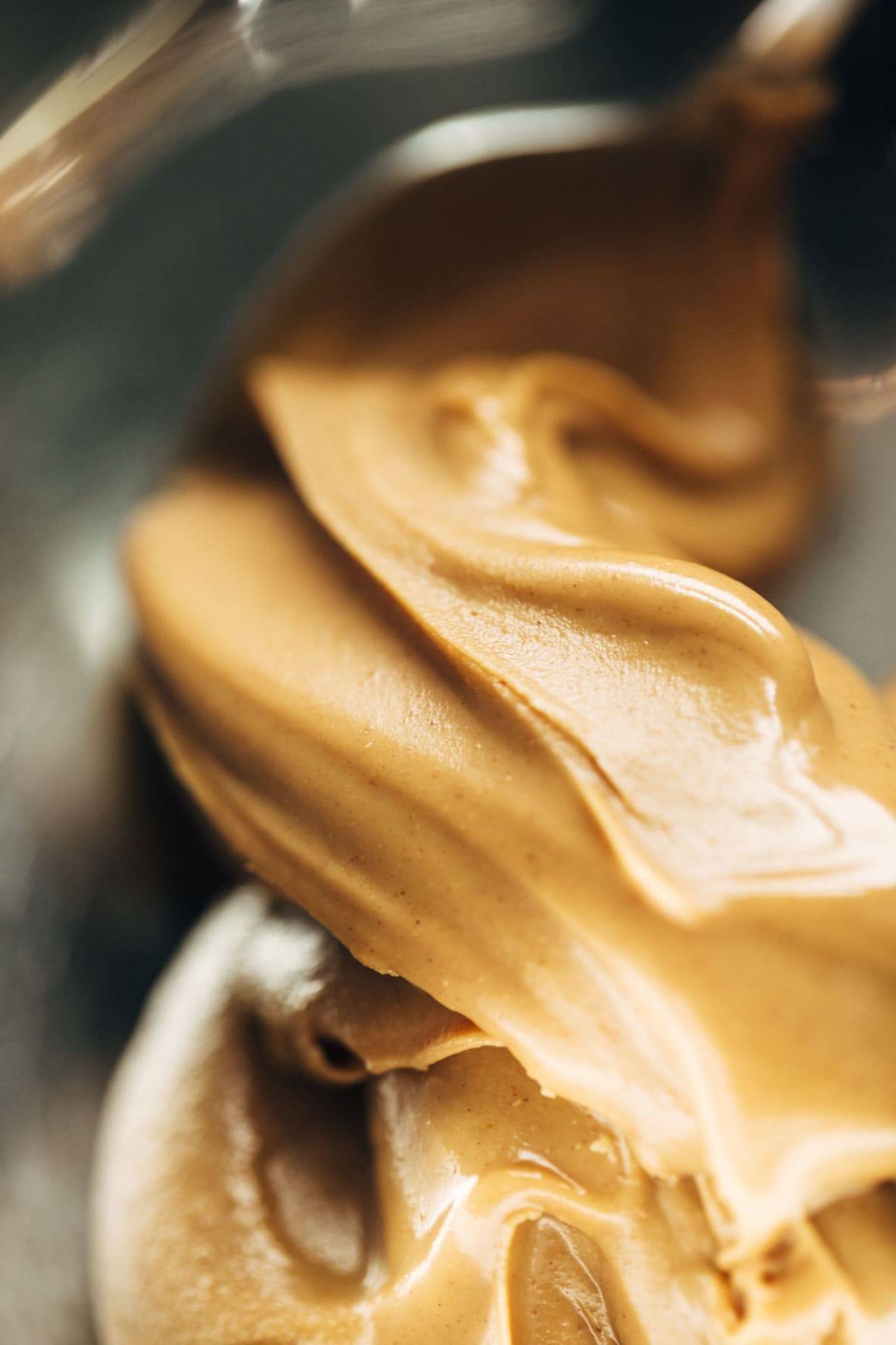 Creamy peanut butter with a spoon.