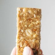 Granola bar being held by hand.