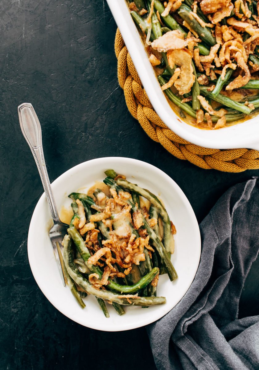 Green bean casserole on a plate with a fork.