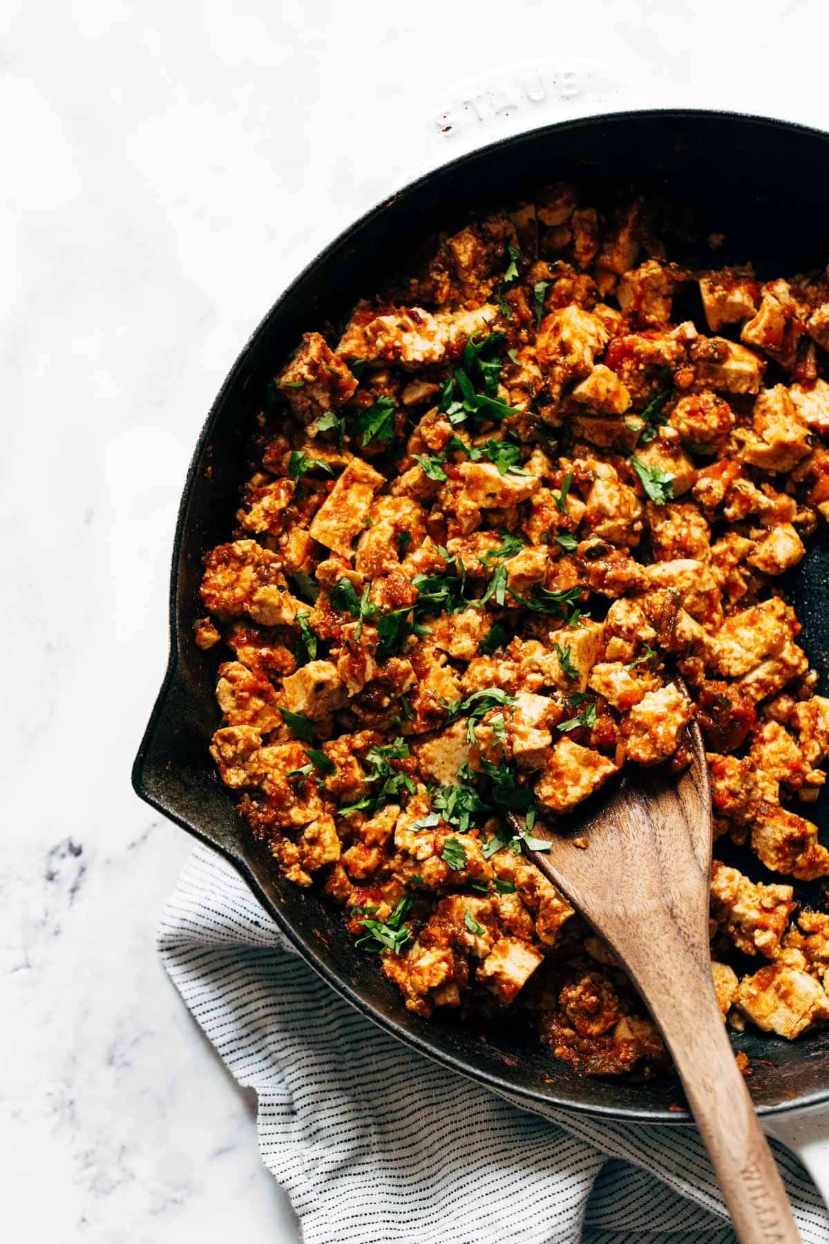 Sofritas in a pan with a spoon.