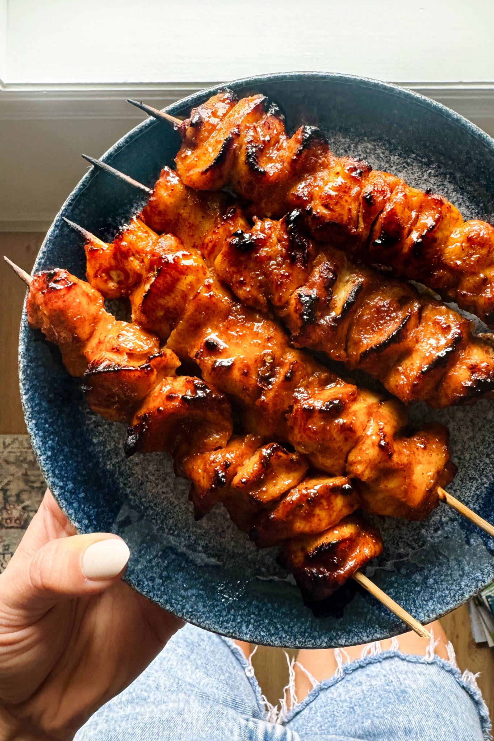Honey chipotle chicken skewers on a plate.