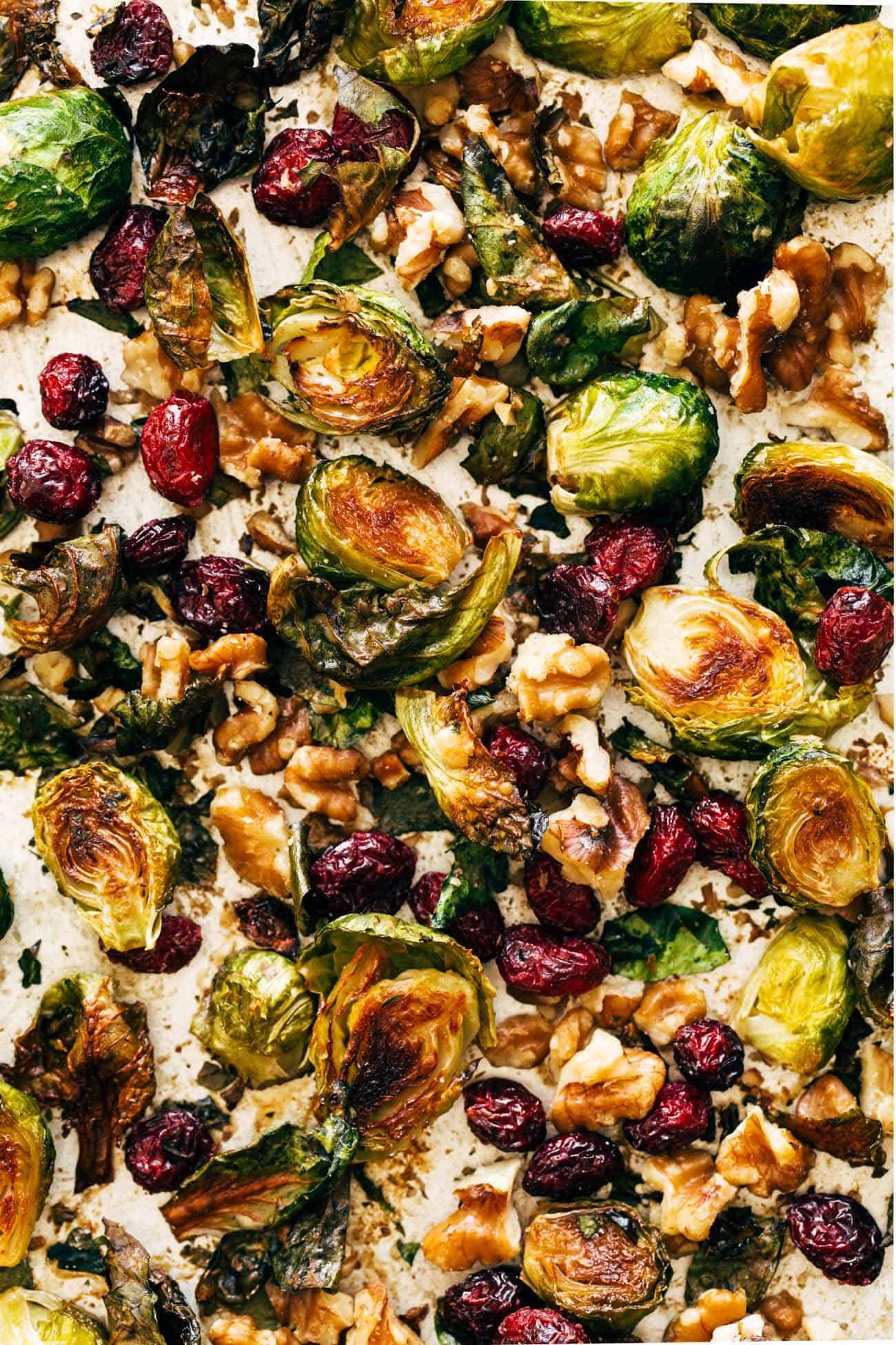 Close-up of Brussels sprouts on pan with walnuts and cranberries