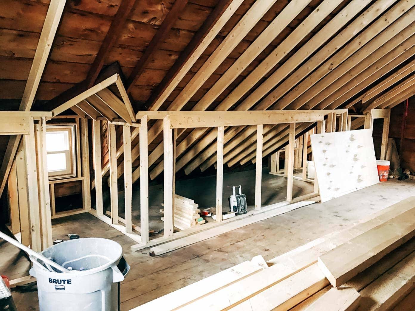 Remodeling attic with large wooden beams.