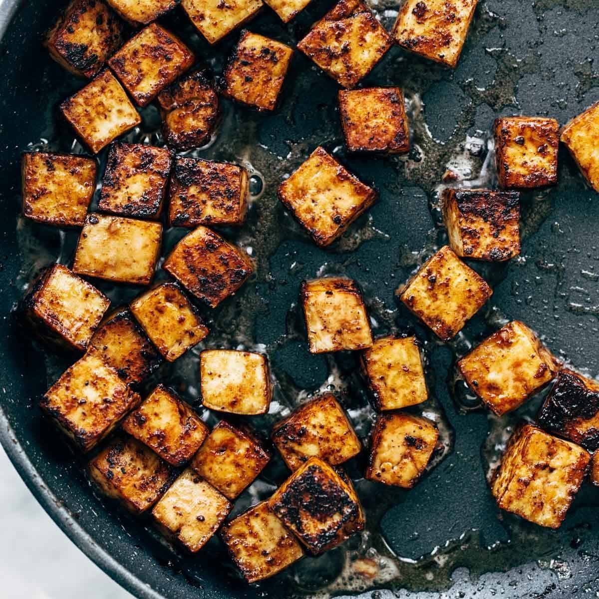 Pieces of tofu cooked with peanut sauce.