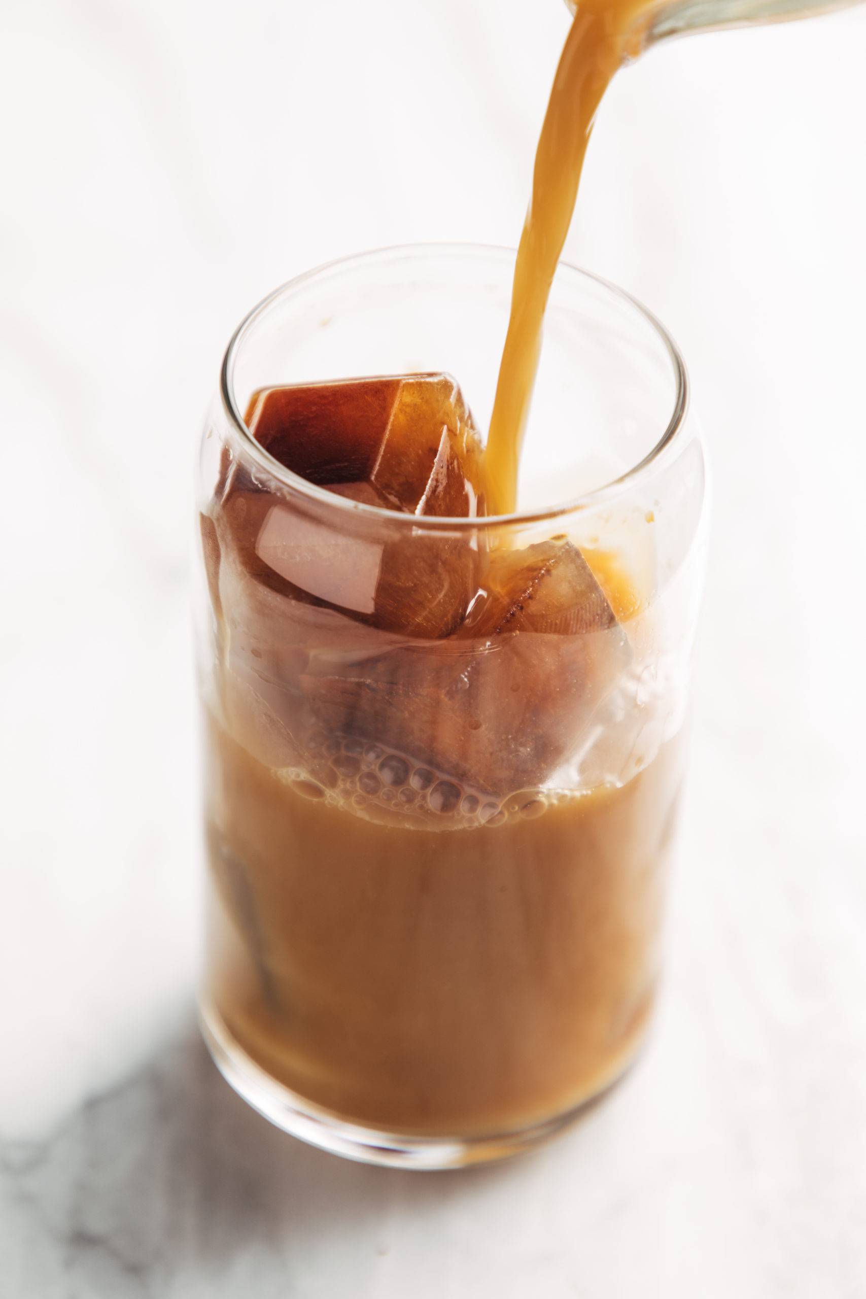 Cold brew coffee with coffee ice cubes in a glass