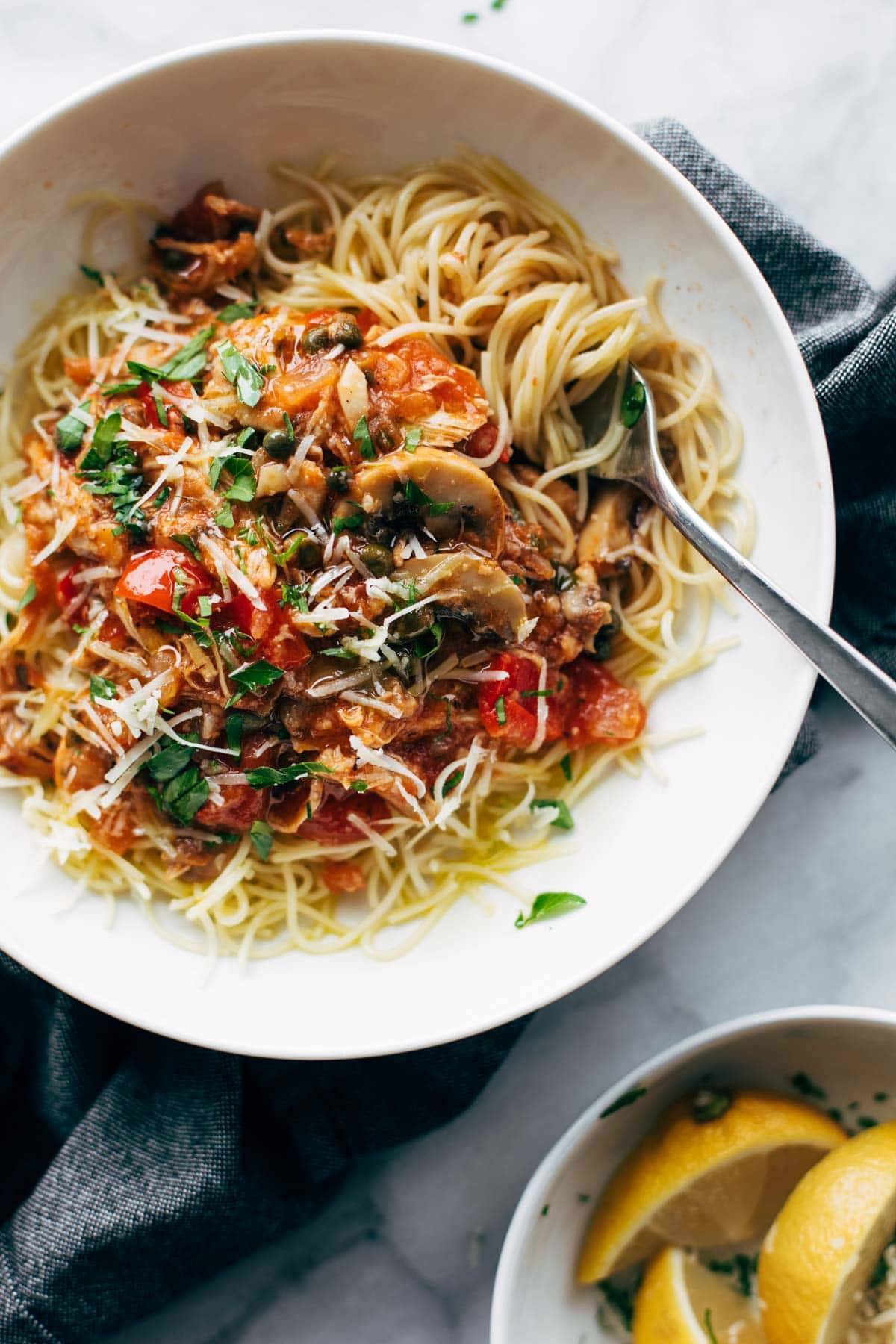 Instant Pot Chicken Cacciatore in a bowl with pasta.