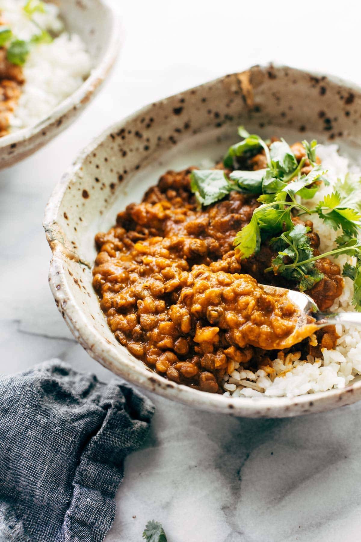 Red curry lentils in a bowl with rice.