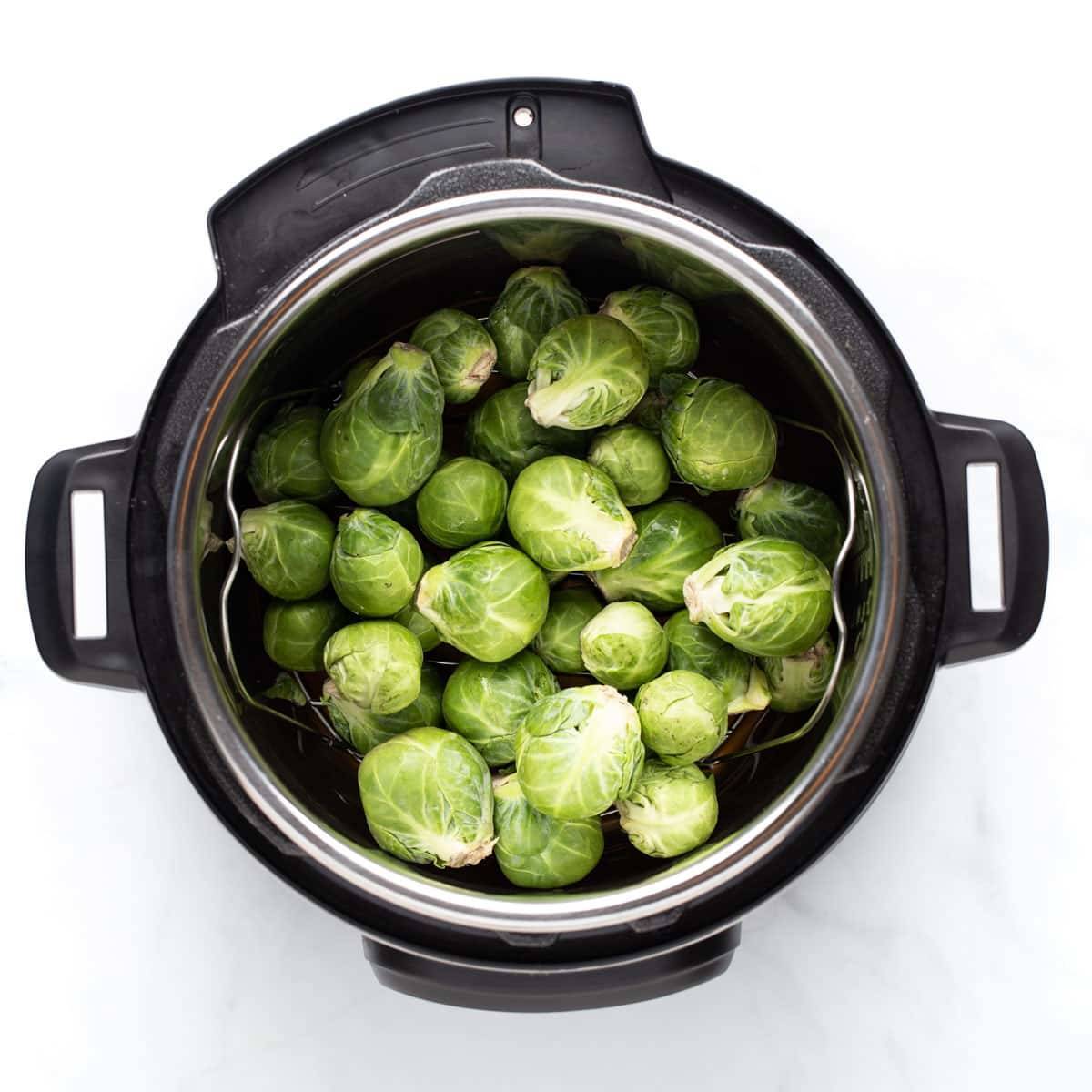 Raw Brussels sprouts in the Instant Pot.