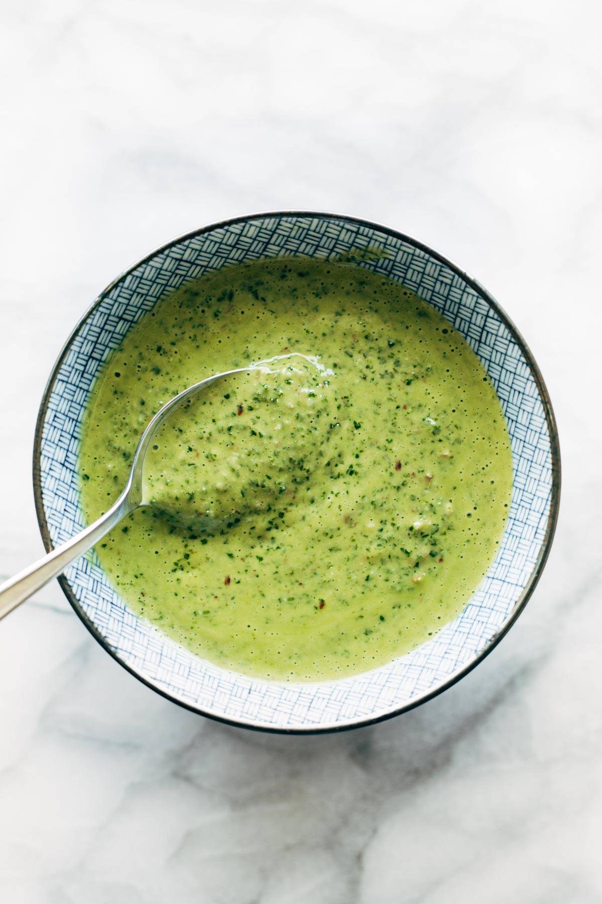 Kale Chimichurri in a bowl with a spoon.