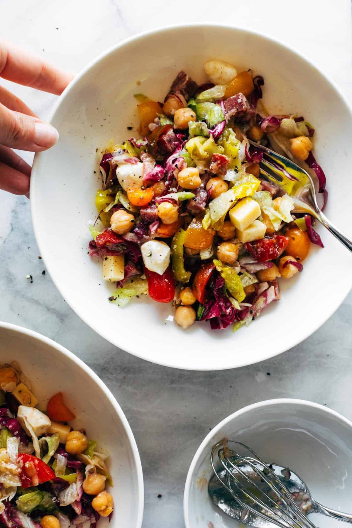 Chop salad in a bowl with fork.
