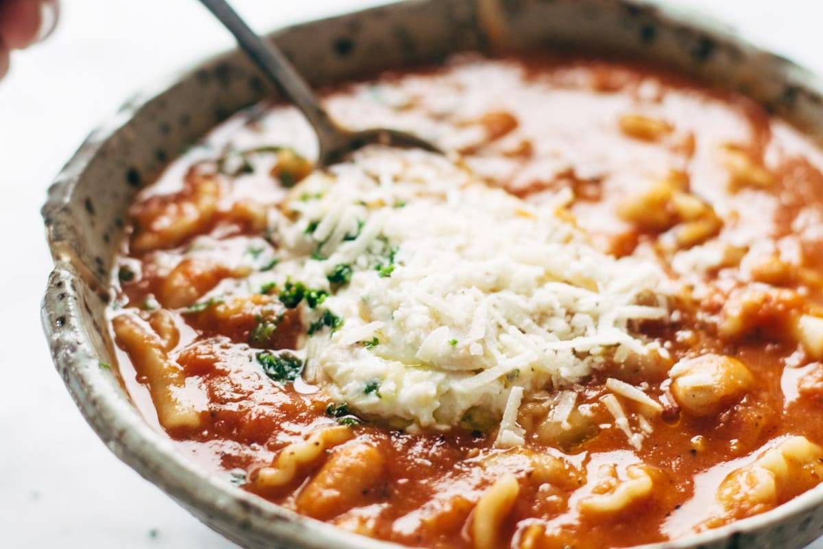 Lasagna White Bean Soup with cheese topping.