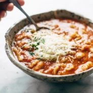 White Bean Lasagna Soup in a bowl with a spoon.